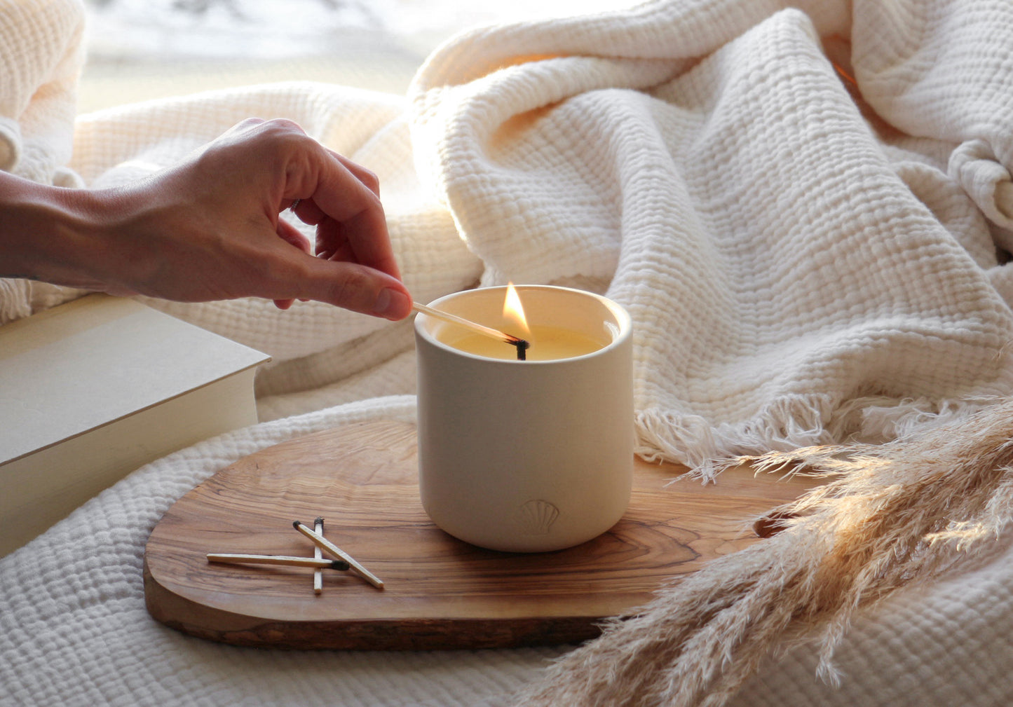beautiful winter day, lighting a handmade clay candle jar
