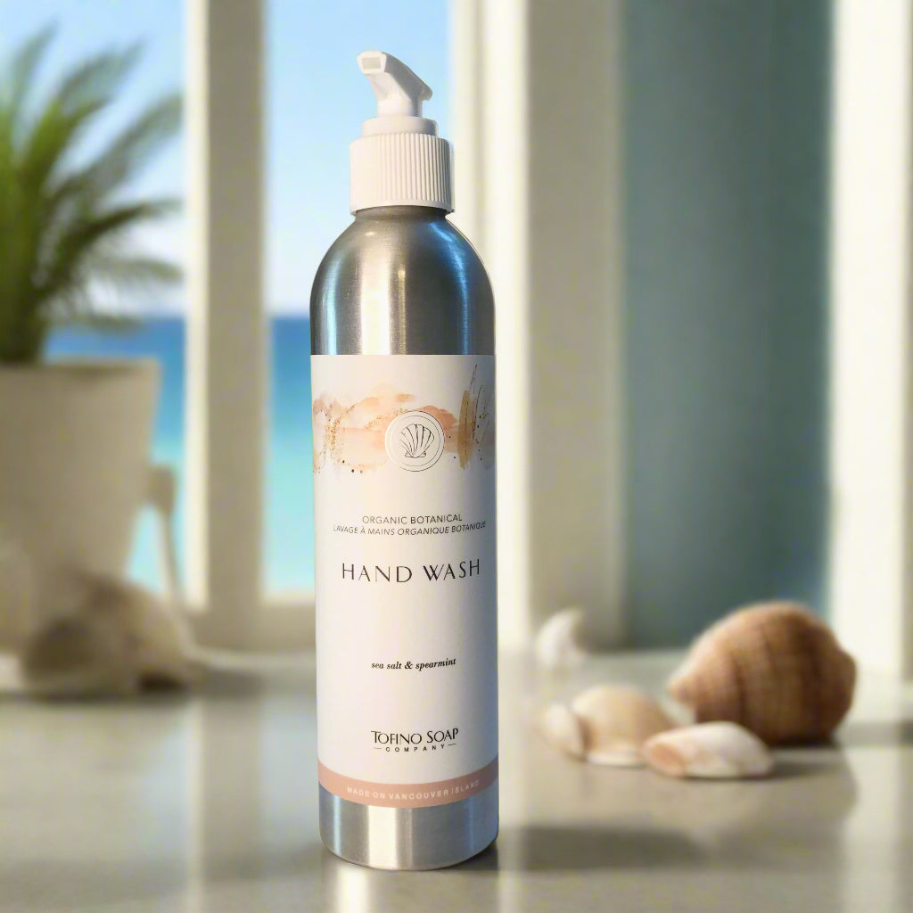 Close-up of Tofino Organic Botanical Hand Wash metal pump bottle showing natural hand soap formula with wild-foraged ingredients