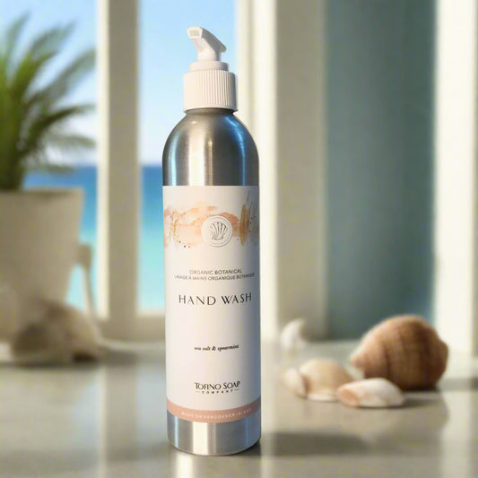 Close-up of Tofino Organic Botanical Hand Wash metal pump bottle showing natural hand soap formula with wild-foraged ingredients