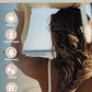 A promotional graphic for Tofino Soap Organic Botanical Haircare. The image shows a woman from behind with long wavy brown hair, wearing a white bikini top, with a light blue ocean background.