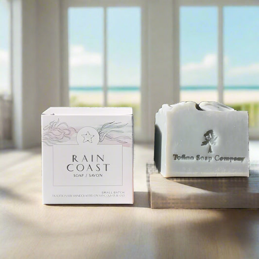 Tofino Soap Company soap bar and packaging on a light surface with large windows in background