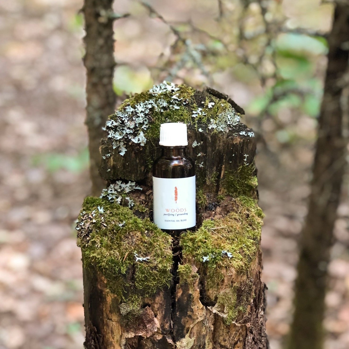 Woods essential oil blend in amber bottle, by Tofino Soap Company